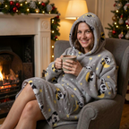 Woman by the fireplace in the Panda Moon Snugzilla